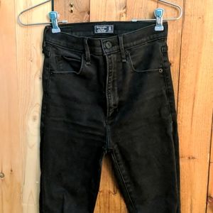 High rise black distressed skinnies